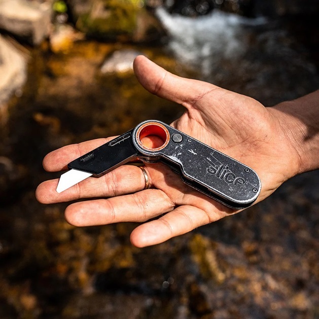 person holding utility knife