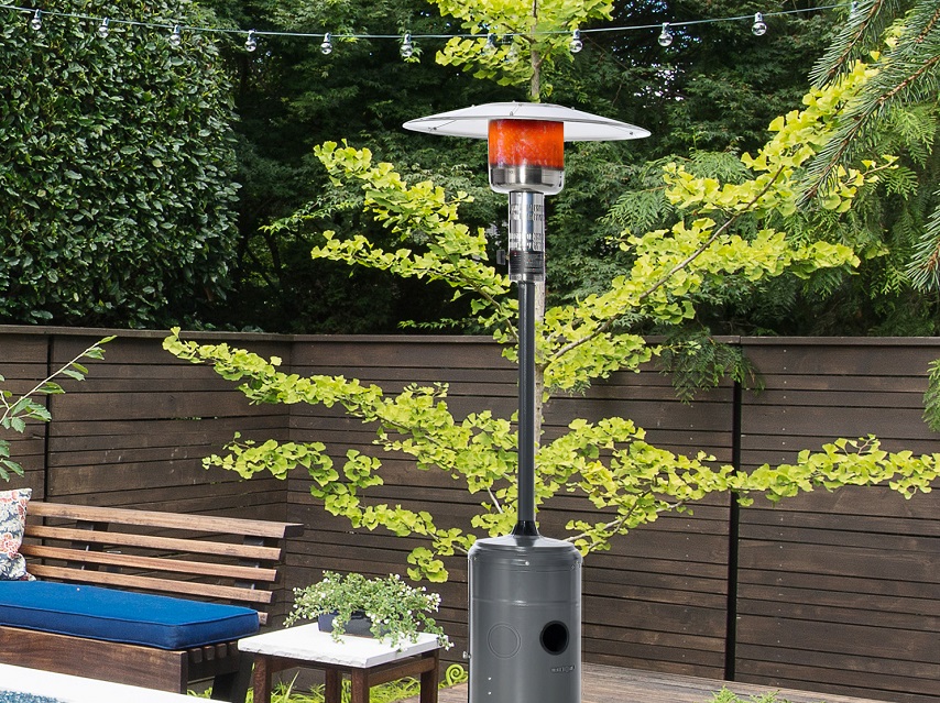 gas patio heater next to the outdoor furniture