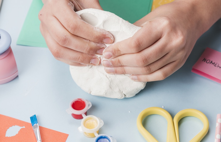 woman using modelling clay