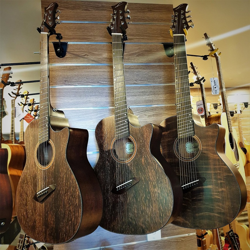 Acoustic guitars hanging on a wall